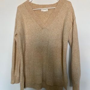 V-neck sweater with a small high-low & side slit